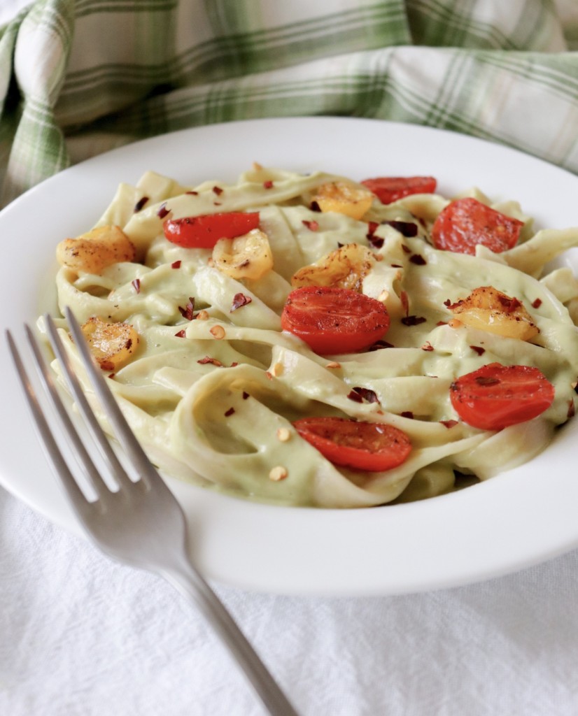 vegan pasta dish with avocado pesto and blistered tomatoes the modern day girlfriend 