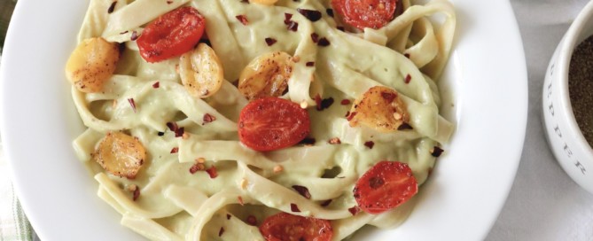 vegan pasta dish with avocado pesto and blistered tomatoes the modern day girlfriend