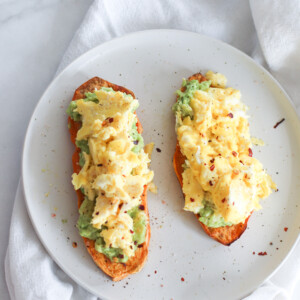 sweet potato toast with smashed avocado and soft scrambled eggs