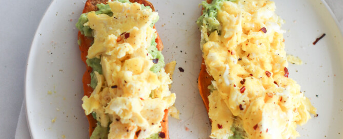 sweet potato toast with smashed avocado and soft scrambled eggs